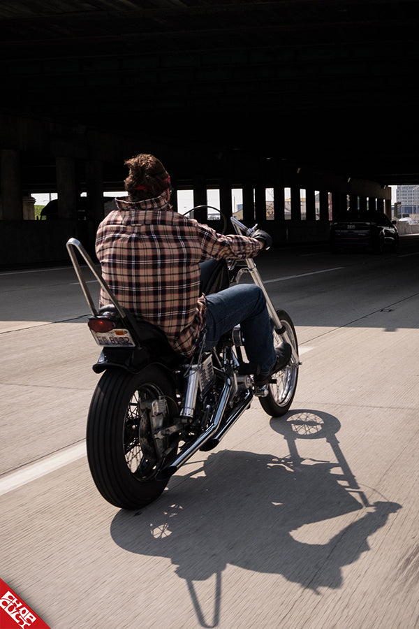 Andrew riding his bike away
