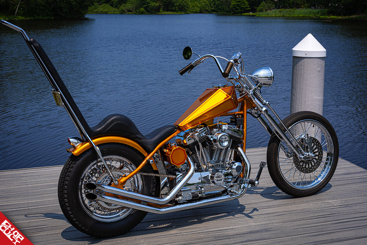 Orange motorcycle b side rear angle