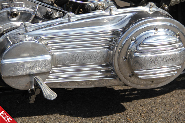 A close up of the scripted words "cost" and "money" engraved on the side of the bike
