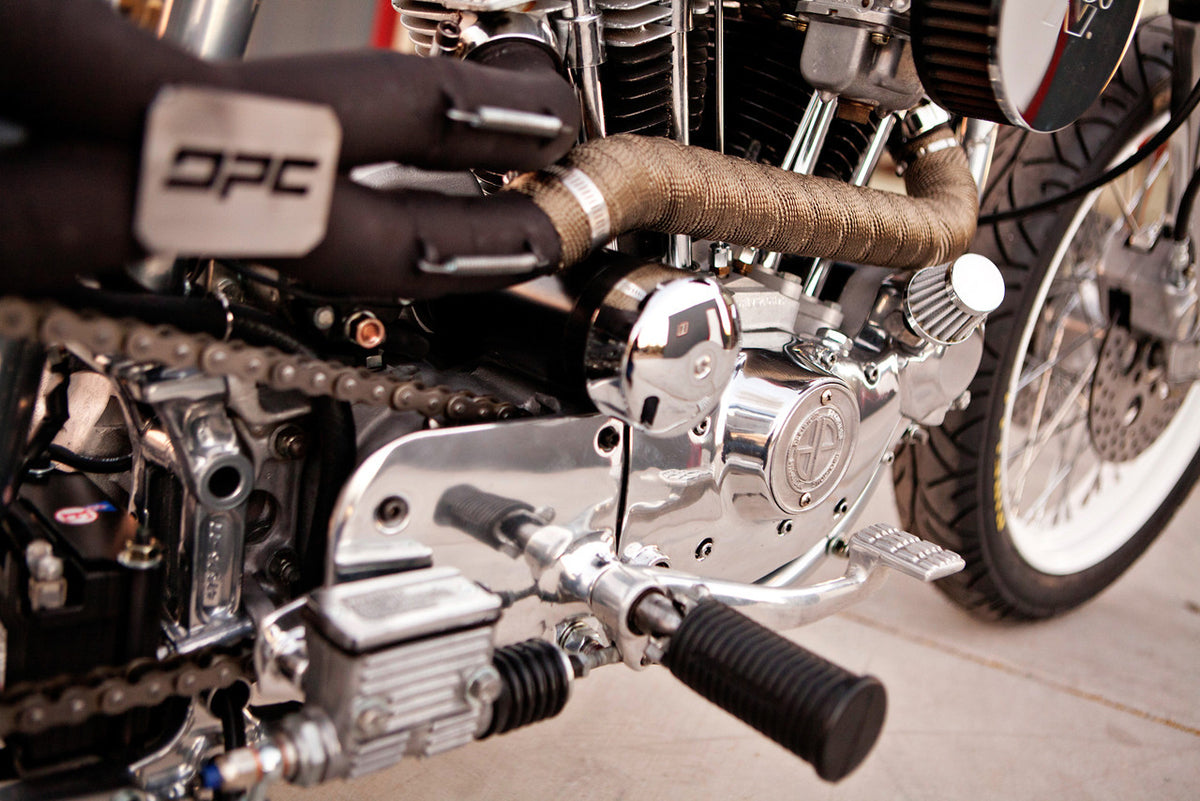 A close up of the bike's motor and exhaust system