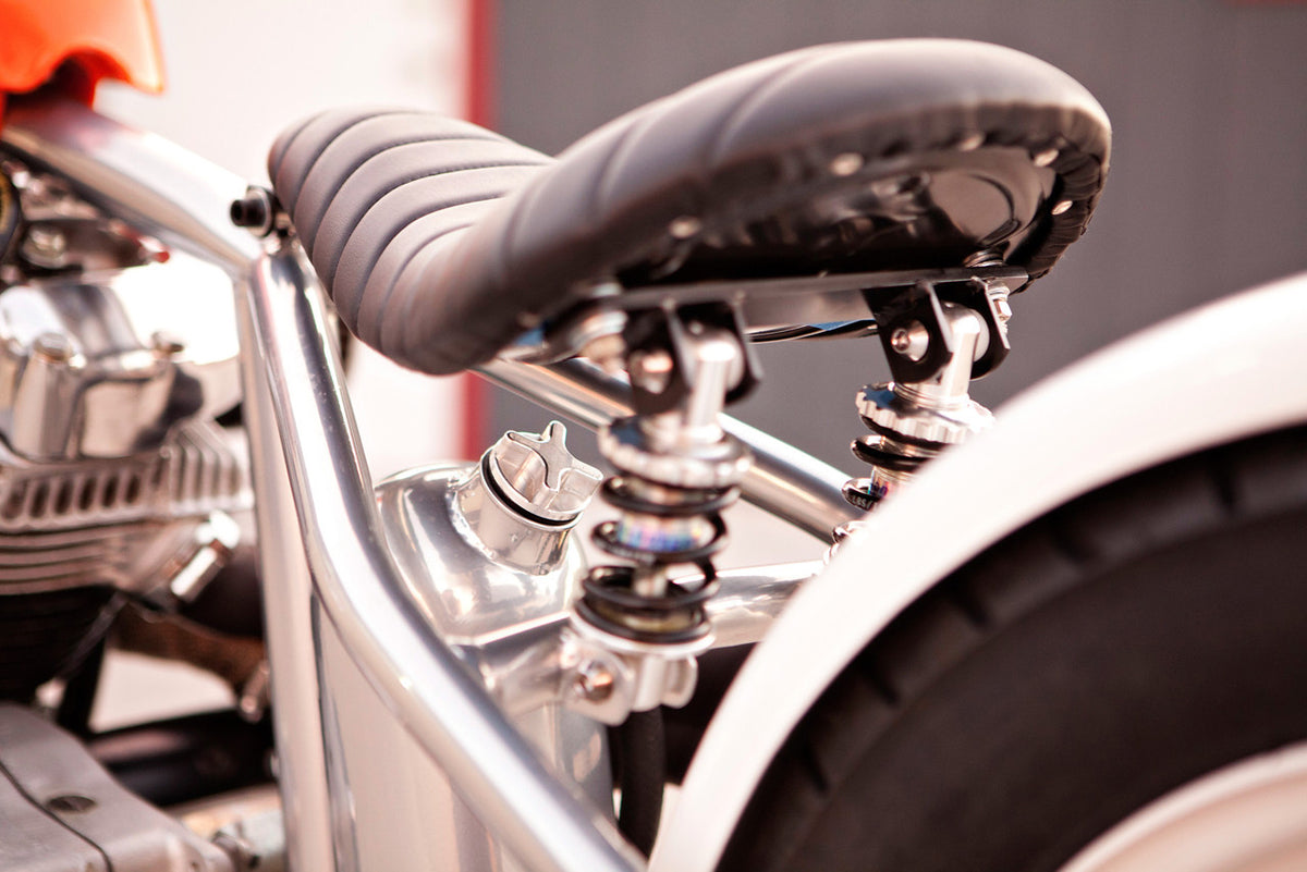 A photo of the bike's seat and seat suspension