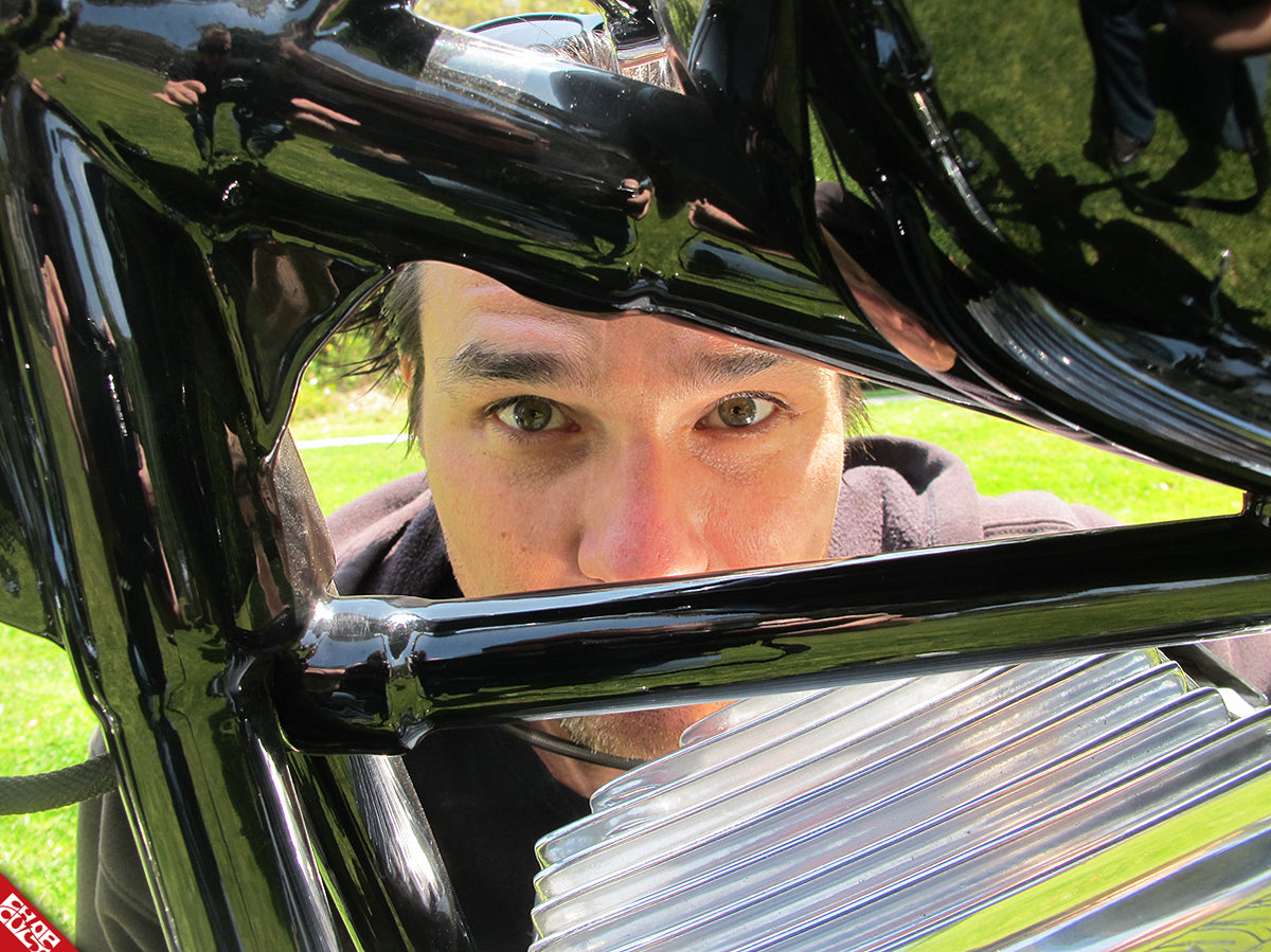 Caleb looking through bike frame