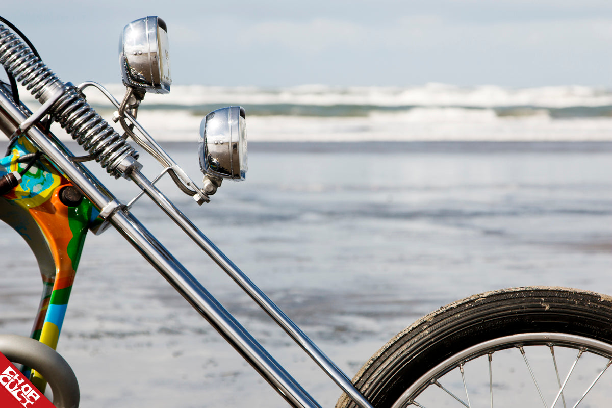 A close up of the bike's fork and headlights