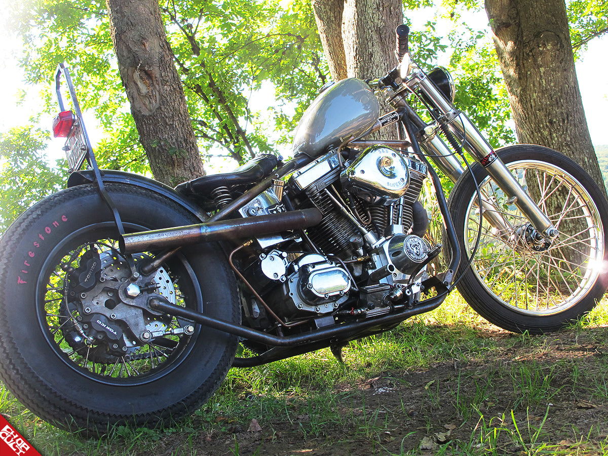 A photo of the right side of the bike displaying the motor, frame, and exhaust