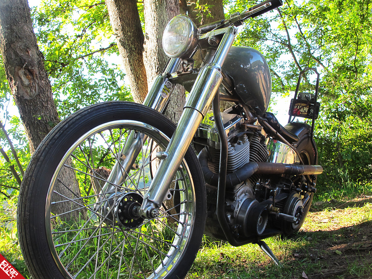 A photo of the front of the bike displaying its headlight, fork, and front tire